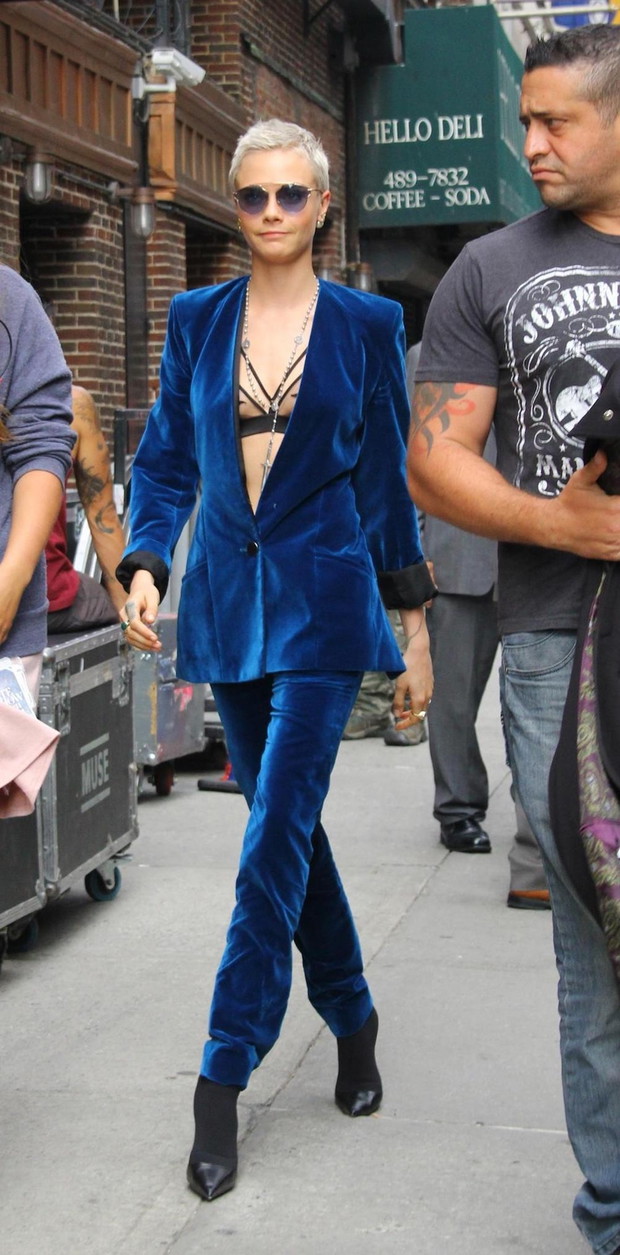 Cara Delevingne wears a blue suede suit as she arrives at The Late Show with Stephen Colbert in New York