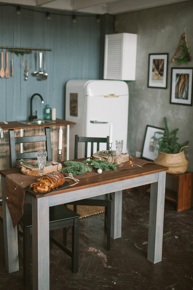 Beautiful holiday decorated kitchen with Christmas cake on the table