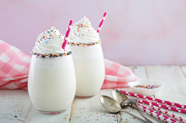 Vanilla milkshake with whipped cream and sprinkles
