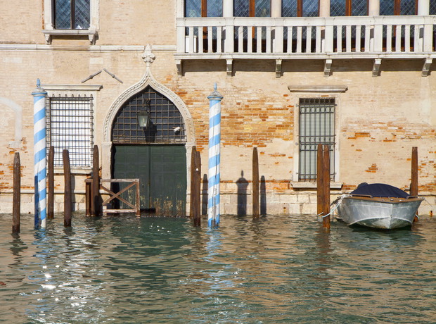 High tide in Venice fllooding antique palace on Grand Canal