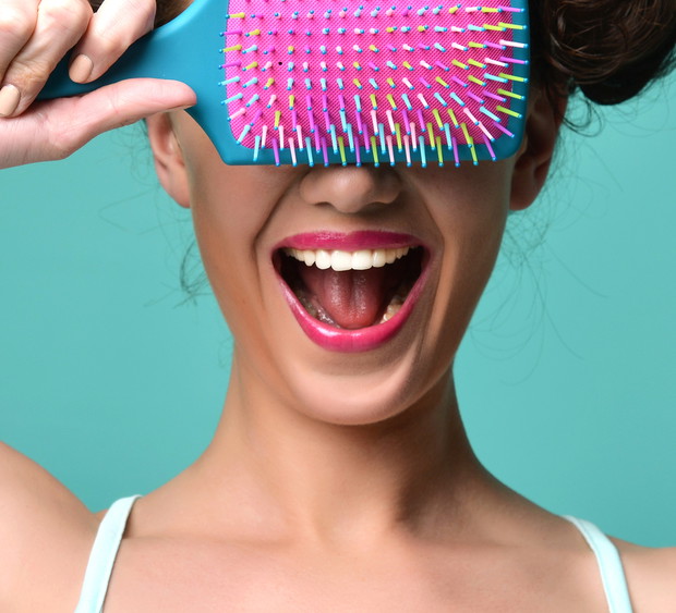 happy fashion brunette woman close eyes with colorful pink blue