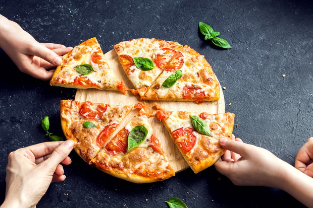 Taking Slice Of Pizza Margherita