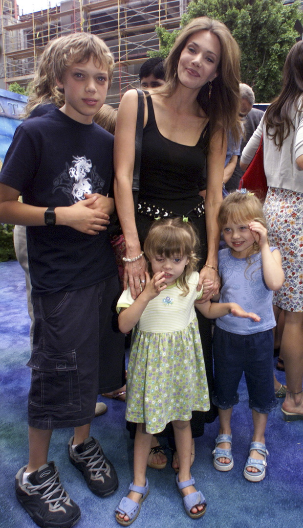 File photo of actress and model Hunter Tylo and her children arriving at a premiere in Hollywood