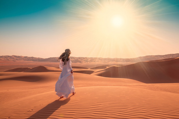 UAE. Woman in desert