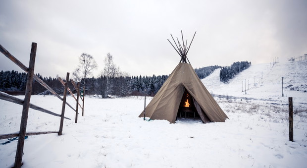 Wigwam in winter forest