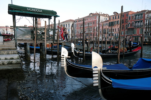 Gondolas are seen during an exceptional low tide in the lagoon city of Venice