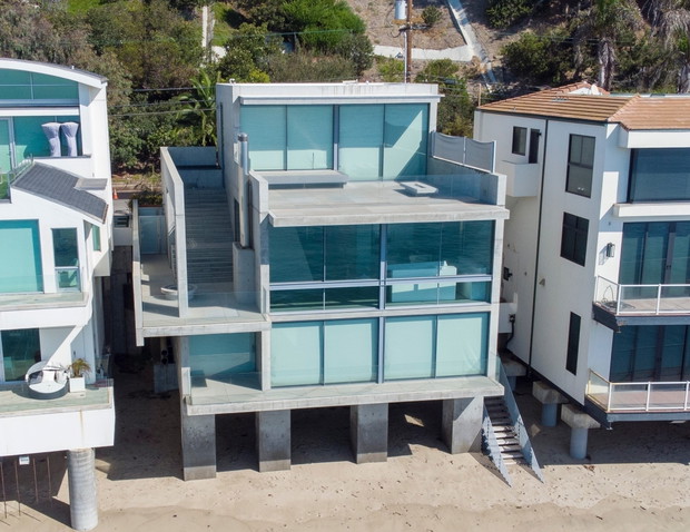 *EXCLUSIVE* Billionaire rapper Kanye West appears to have dropped $57.25 million on a box-like Malibu house as he navigates his divorce from Kim Kardashian