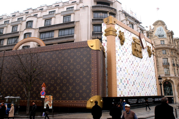 Giant luggage seen on the side of the Louis Vuitton store on