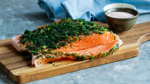 Gravlax or gravlaks is a Nordic dish consisting of raw salmon, cured in salt, sugar, and dill
