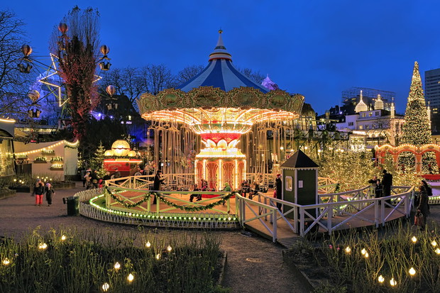 Evening view of carousel and christmas illumination in Tivoli Gardens in Copenhagen, Denmark