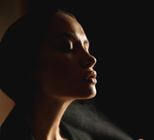 Womman spraying perfume