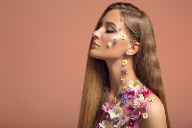 Portrait of beautiful woman. Flowers make up.