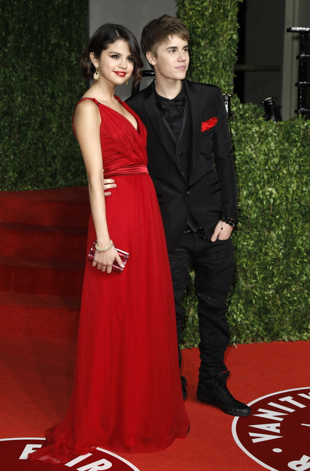 Singer Justin Bieber and singer Selena Gomez arrive at the 2011 Vanity Fair Oscar party in West Hollywood