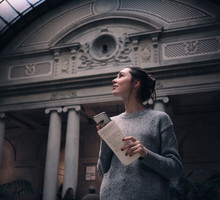 Portrait of a young attractive woman visiting museum or gallery