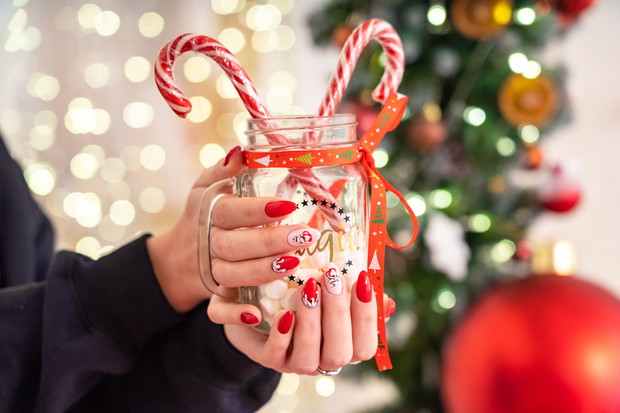 manicure on hands in new year style.