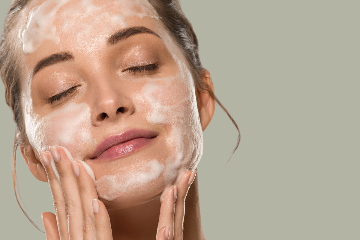 Soap face woman clean skin beauty. Color background. Green