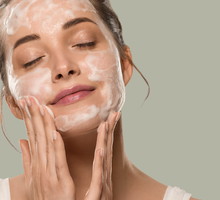 Soap face woman clean skin beauty. Color background. Green