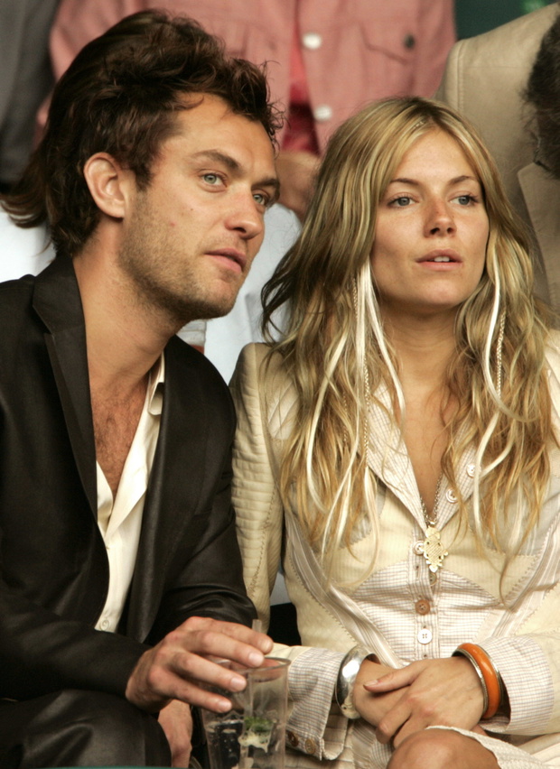 BRITISH ACTOR LAW AND MILLER OF U.S. WATCH BRITAIN'S HENMAN AT WIMBLEDON.