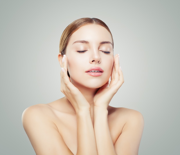 Pretty woman with closed eyes  and young healthy skin. Facial tr
