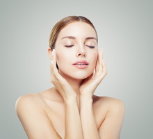 Pretty woman with closed eyes and young healthy skin. Facial tr