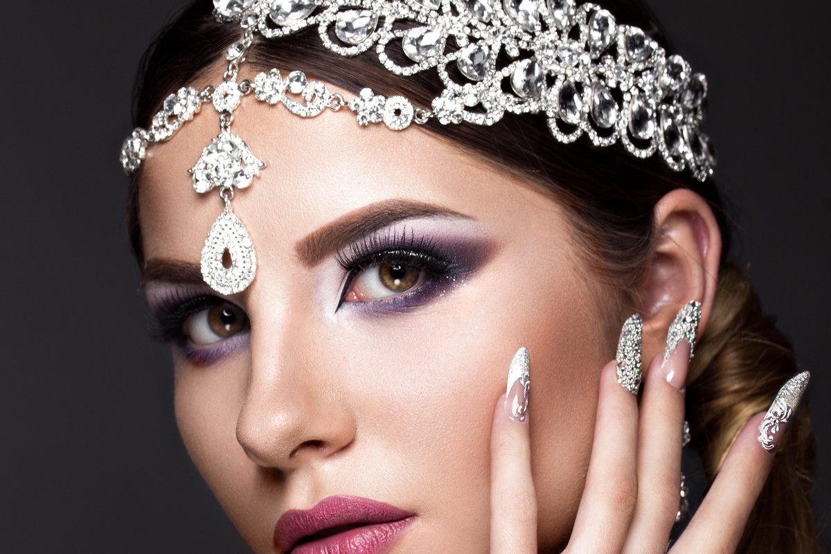 Beautiful girl in image of Arab bride with expensive jewelry, oriental make-up and bridal manicure. beauty face.