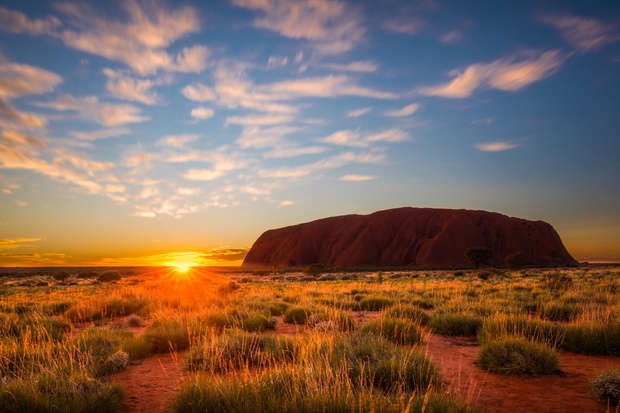 Sun rising over Uluru, Uluru-Kata Tjuta National Park, Northern