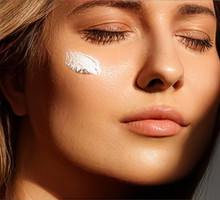 Beauty, suntan spf and skincare cosmetics model face portrait, woman with moisturising cream, sunscreen product or sun tan lotion on her cheek, luxury facial and skin care