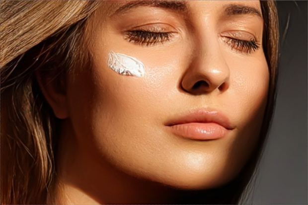 Beauty, suntan spf and skincare cosmetics model face portrait, woman with moisturising cream, sunscreen product or sun tan lotion on her cheek, luxury facial and skin care