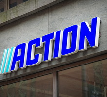 Action store with logo sign board hanging above entrance door. Action is fastest growing non-food discounter in Europe, Dutch international discount store. The Hague, the Netherlands. 15 February 2025