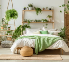Boho bedroom interior featuring bed, ladder, and plant with green decor.