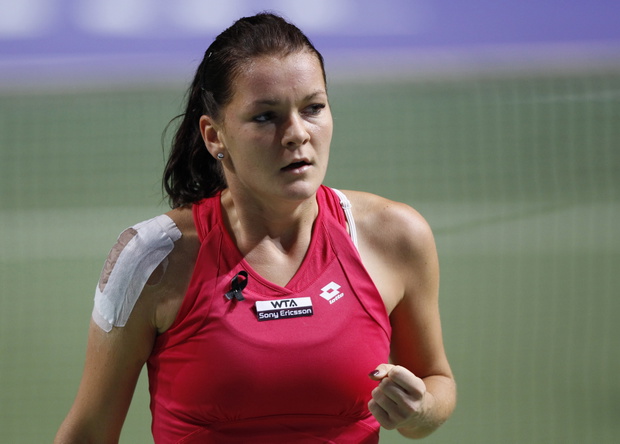 Radwanska of Poland reacts after winning a point against Zvonareva of Russia during their WTA tennis championships match in Istanbul