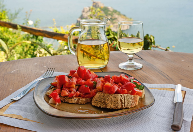 Italian bruschetta and white wine against the background of the