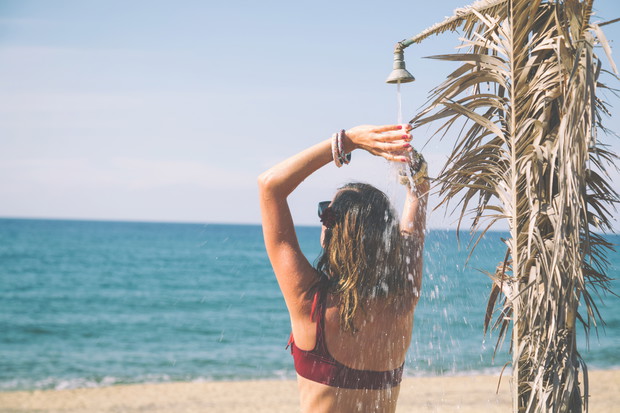 Attractive fashionable woman having fun on the beach.