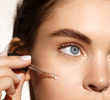 Beauty and skincare concept. Female model using natural moisturizer with active natural ingredients, collagen and hyaluronic acid for better skin tone and face nourishment