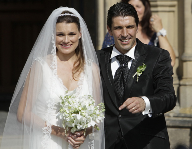 Italy's national soccer team goalkeeper Gianluigi Buffon with his wife Alena Seredova leave the church after their wedding in Prague