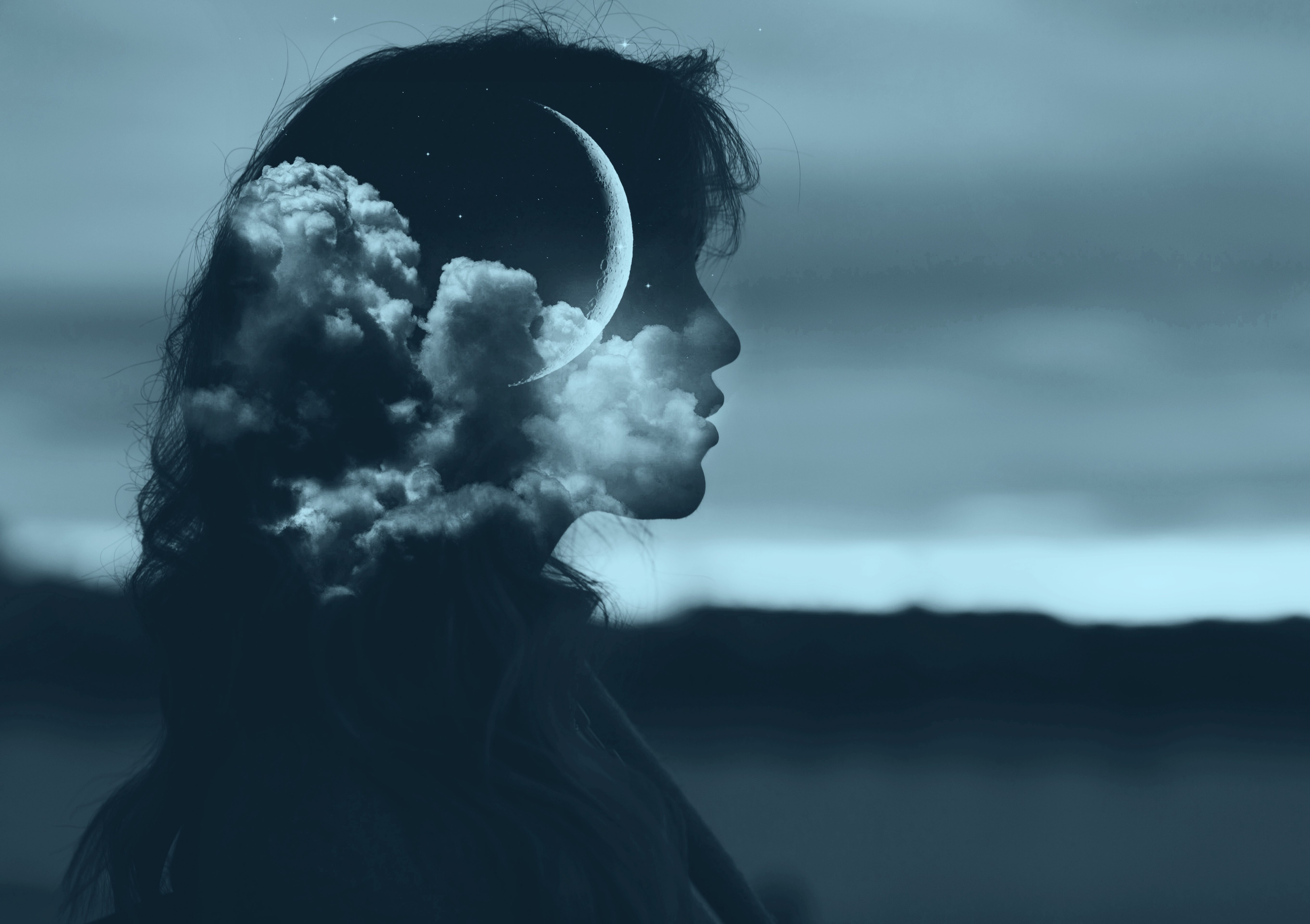Beautiful woman profile silhouette portrait with moon in her head