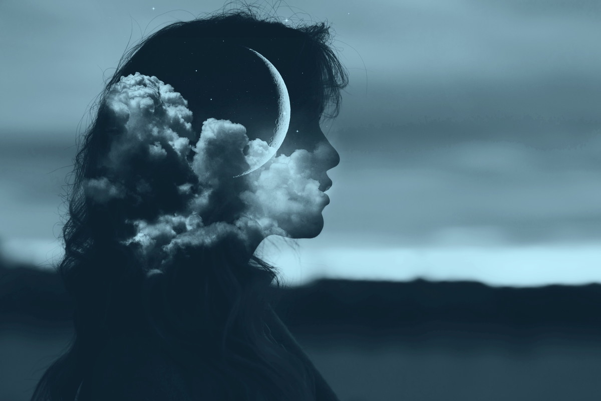 Beautiful woman profile silhouette portrait with moon in her head