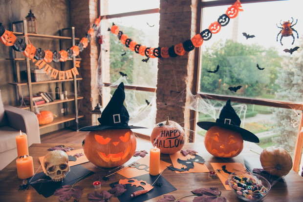 Preparation for halloween, cutted pumpkin, fall leaves, spiders