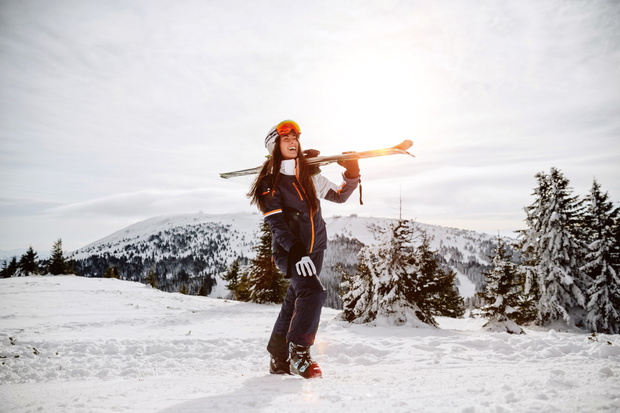 enjoying skiing at ski resort in mountains on a sunny winter day