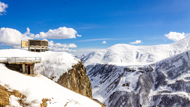 Spectacular mountain landscape in winter. Popular tourist spot Monument of Friendship of Peoples in Georgia