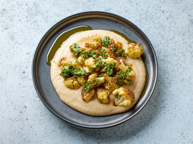 butter beans puree with baked cauliflowers on plate