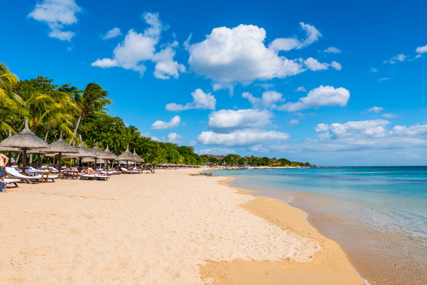 Mauritius beach umbrellas, thatch. Tropical Mauritius island water &amp; beach resort, Turtle Bay - Balaclava