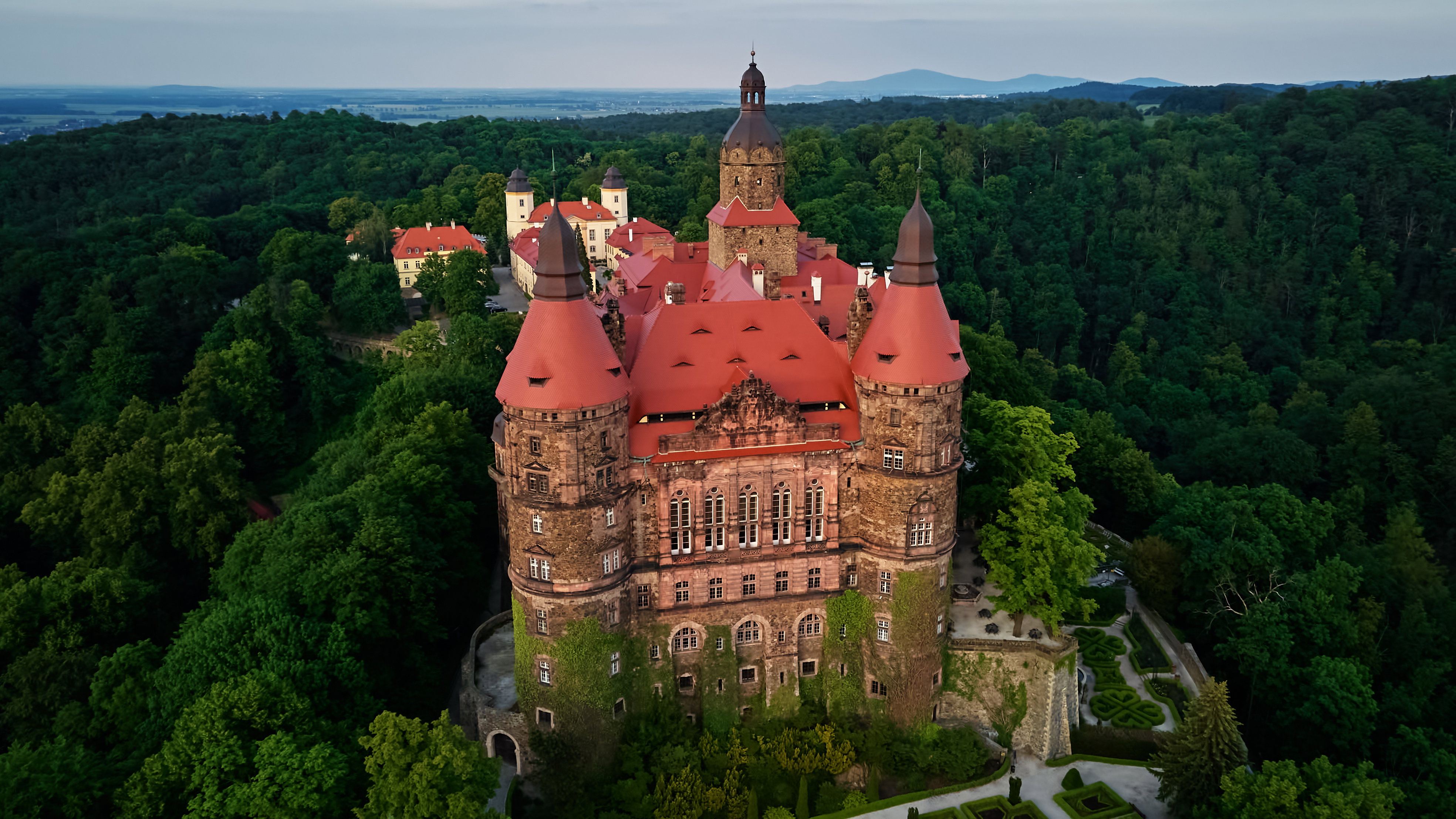 Aerial View of Historic Ksiaz Castle Surrounded by Forest