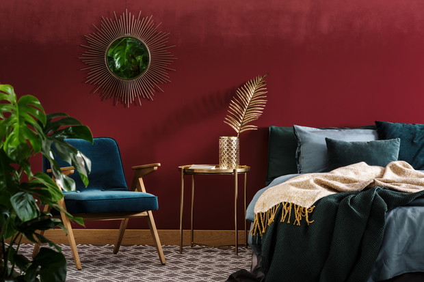 Sophisticated red bedroom with mirror