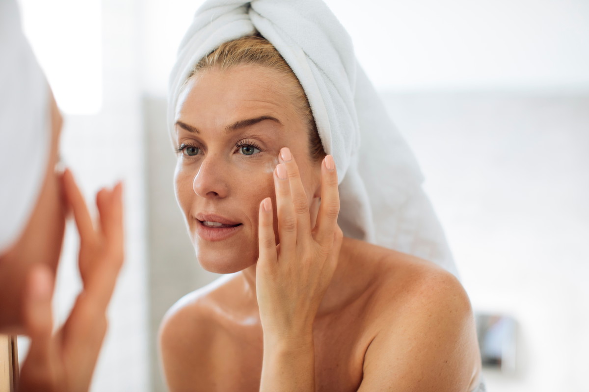 Woman Applying Moisturising Creme on Her Face