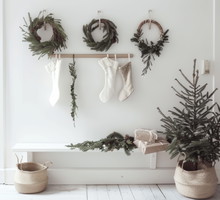 Christmas Scandinavian nordic home decorated with minimalist garlands, wreaths, stockings, white walls showcasing the timeless charm and elegance of Scandi interior design xmas trends