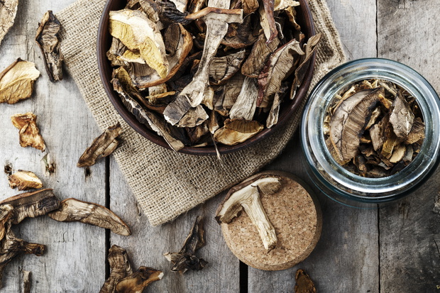 dried mushrooms on a wooden background