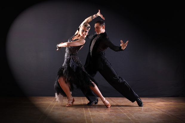 dancers in ballroom isolated on black background