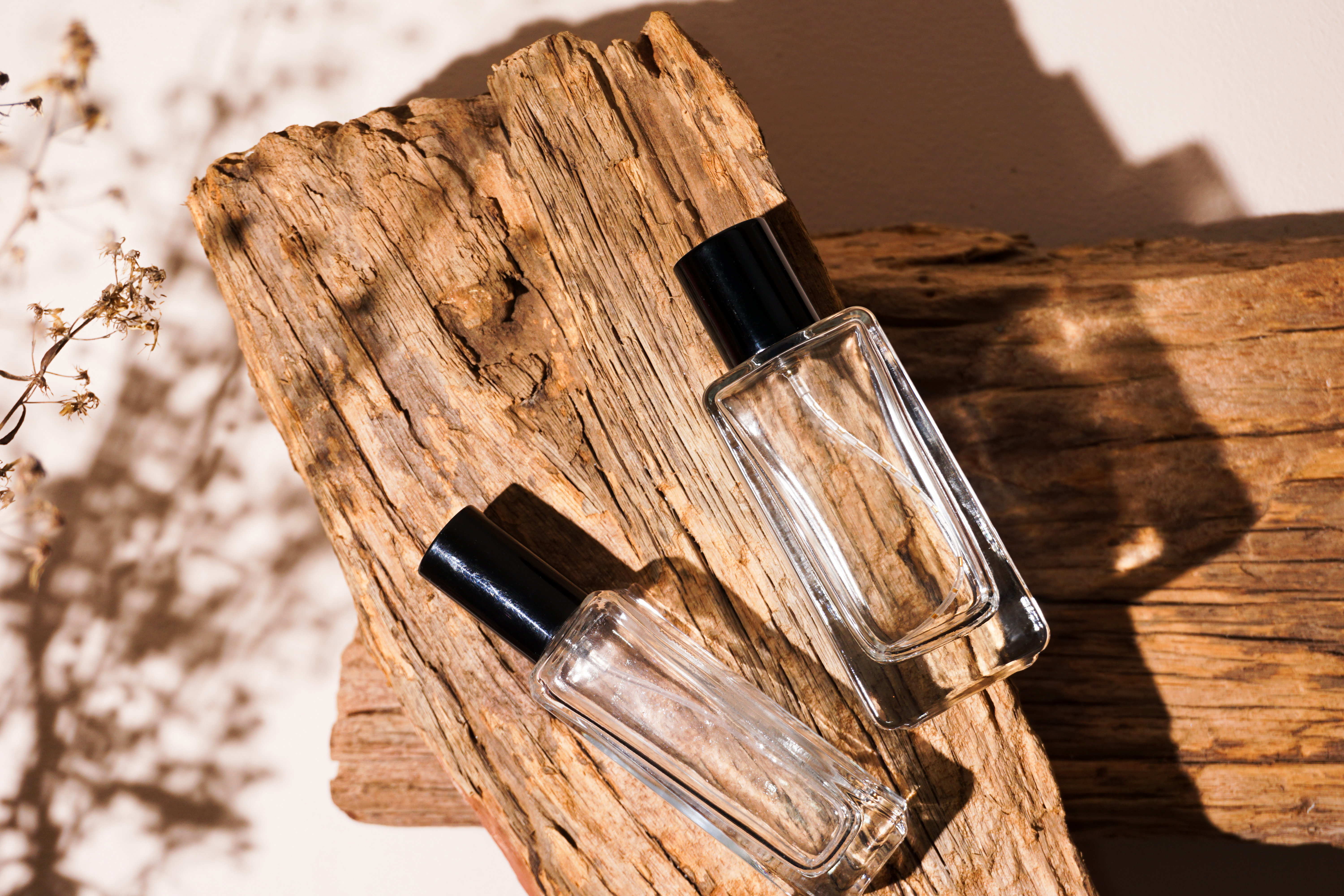 bottle of perfume on wooden background