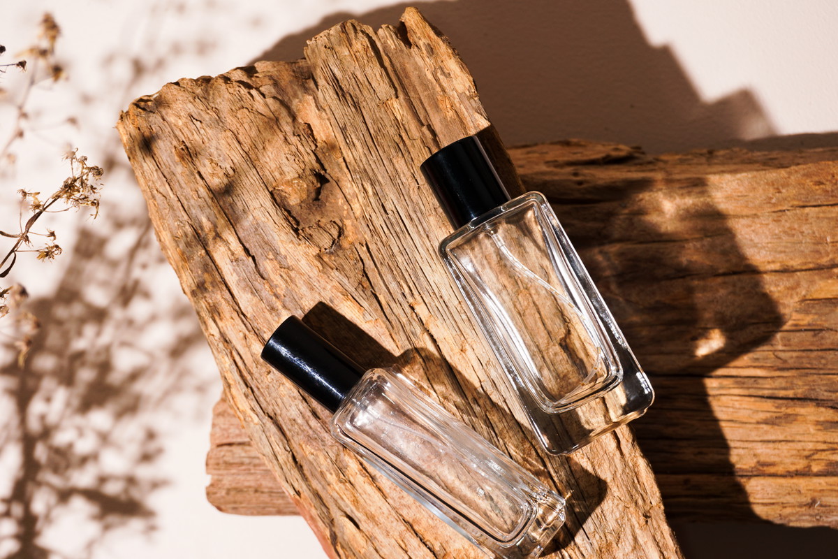 bottle of perfume on wooden background